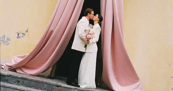 A Whimsical Wedding with a Giant Bow and Curved Tablescape