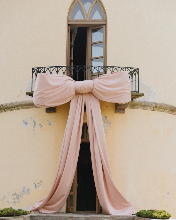A Whimsical Wedding with a Giant Bow and Curved Tablescape