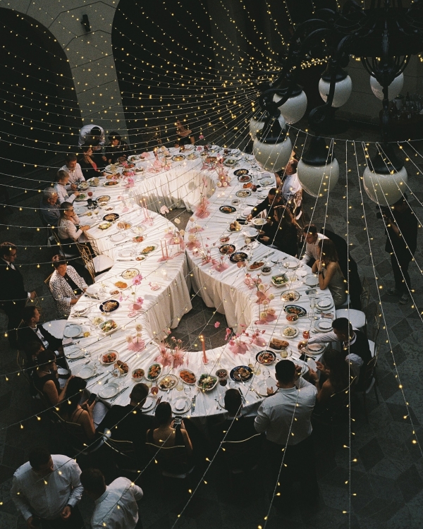 A Whimsical Wedding with a Giant Bow and Curved Tablescape